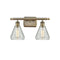 Conesus Bath Vanity Light shown in the Antique Brass finish with a Clear Crackle shade