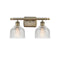 Dayton Bath Vanity Light shown in the Antique Brass finish with a Clear shade