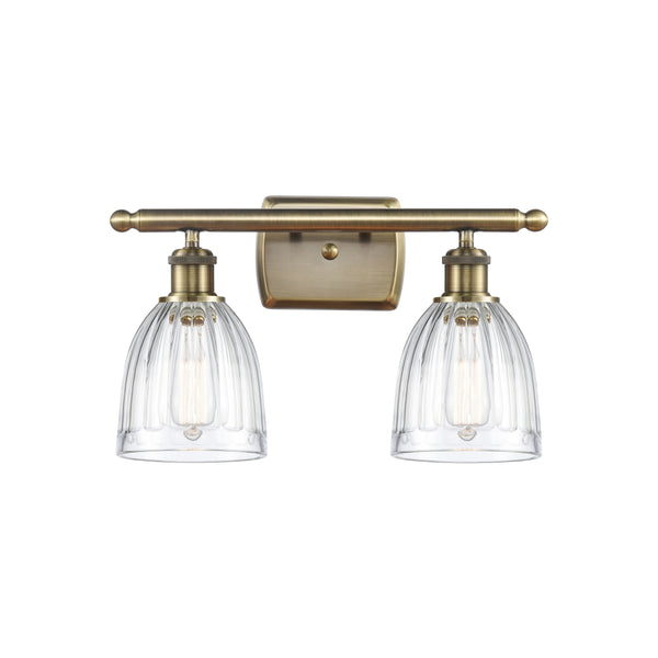 Brookfield Bath Vanity Light shown in the Antique Brass finish with a Clear shade