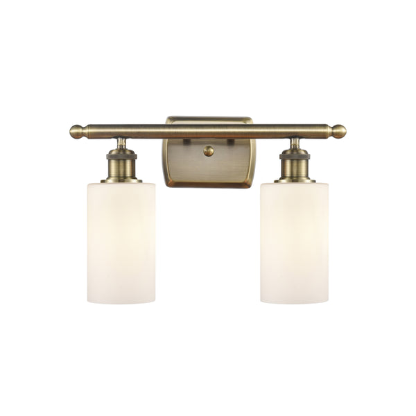 Clymer Bath Vanity Light shown in the Antique Brass finish with a Matte White shade