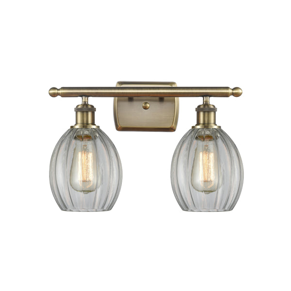 Eaton Bath Vanity Light shown in the Antique Brass finish with a Clear shade