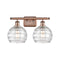 Deco Swirl Bath Vanity Light shown in the Antique Copper finish with a Clear shade
