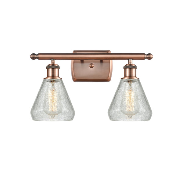 Conesus Bath Vanity Light shown in the Antique Copper finish with a Clear Crackle shade