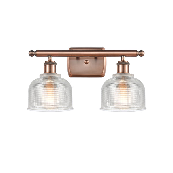 Dayton Bath Vanity Light shown in the Antique Copper finish with a Clear shade