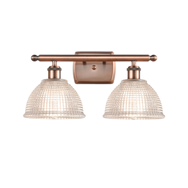 Arietta Bath Vanity Light shown in the Antique Copper finish with a Clear shade