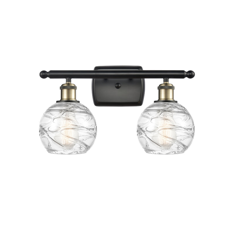 Deco Swirl Bath Vanity Light shown in the Black Antique Brass finish with a Clear shade