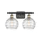 Deco Swirl Bath Vanity Light shown in the Black Antique Brass finish with a Clear shade