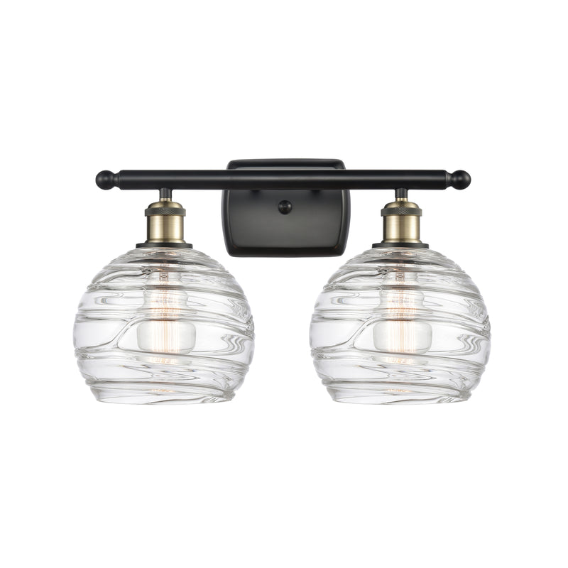 Deco Swirl Bath Vanity Light shown in the Black Antique Brass finish with a Clear shade