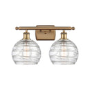 Deco Swirl Bath Vanity Light shown in the Brushed Brass finish with a Clear shade