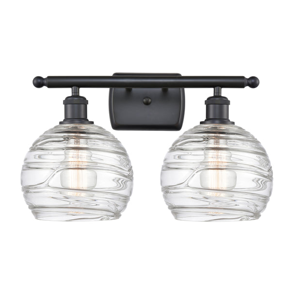 Deco Swirl Bath Vanity Light shown in the Matte Black finish with a Clear shade