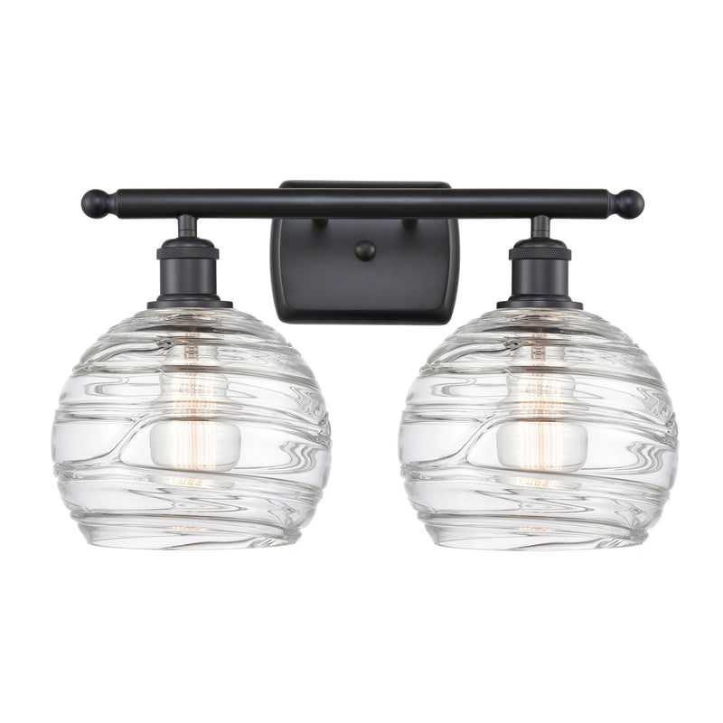 Deco Swirl Bath Vanity Light shown in the Matte Black finish with a Clear shade