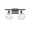 Deco Swirl Bath Vanity Light shown in the Oil Rubbed Bronze finish with a Clear shade