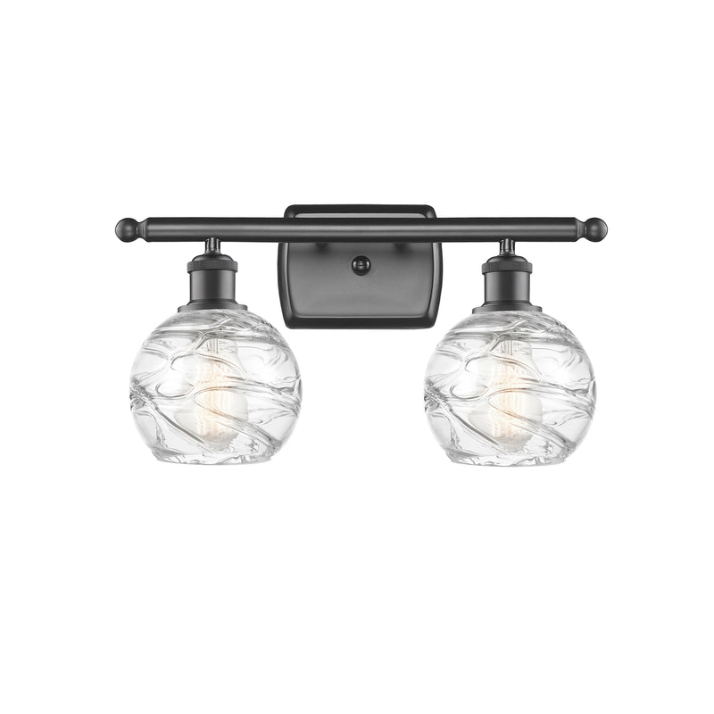 Deco Swirl Bath Vanity Light shown in the Oil Rubbed Bronze finish with a Clear shade