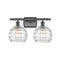 Deco Swirl Bath Vanity Light shown in the Oil Rubbed Bronze finish with a Clear shade
