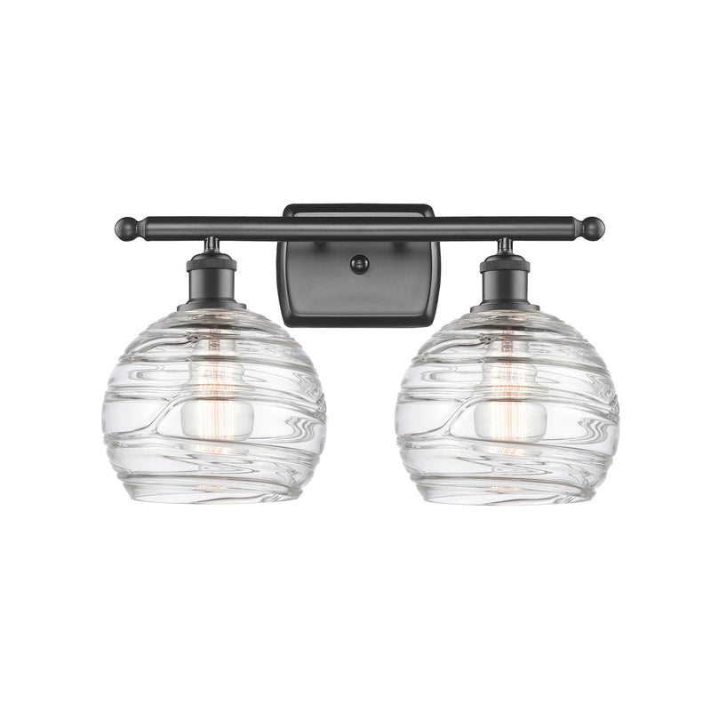 Deco Swirl Bath Vanity Light shown in the Oil Rubbed Bronze finish with a Clear shade