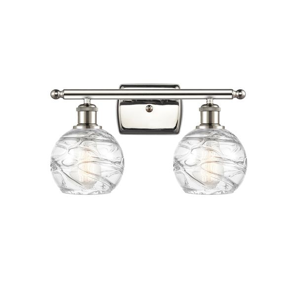 Deco Swirl Bath Vanity Light shown in the Polished Nickel finish with a Clear shade