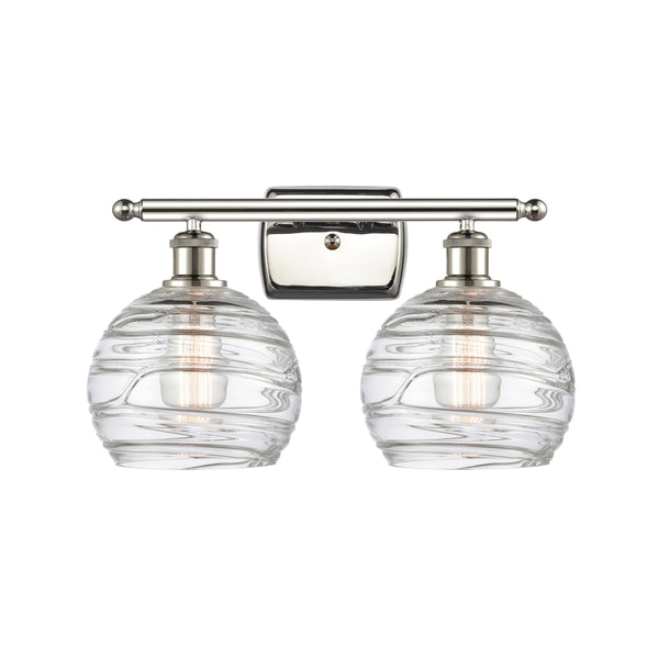 Deco Swirl Bath Vanity Light shown in the Polished Nickel finish with a Clear shade