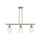 Candor Island Light shown in the Antique Brass finish with a Clear Waterglass shade