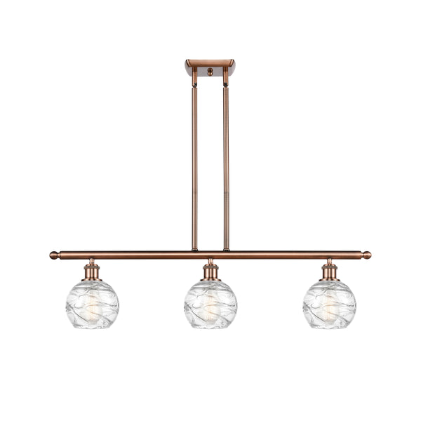 Deco Swirl Island Light shown in the Antique Copper finish with a Clear shade