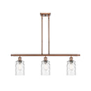 Candor Island Light shown in the Antique Copper finish with a Clear Waterglass shade