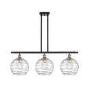 Deco Swirl Island Light shown in the Black Antique Brass finish with a Clear shade