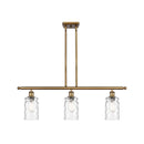 Candor Island Light shown in the Brushed Brass finish with a Clear Waterglass shade