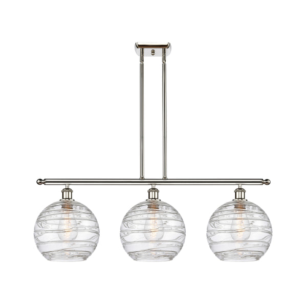 Deco Swirl Island Light shown in the Polished Nickel finish with a Clear shade