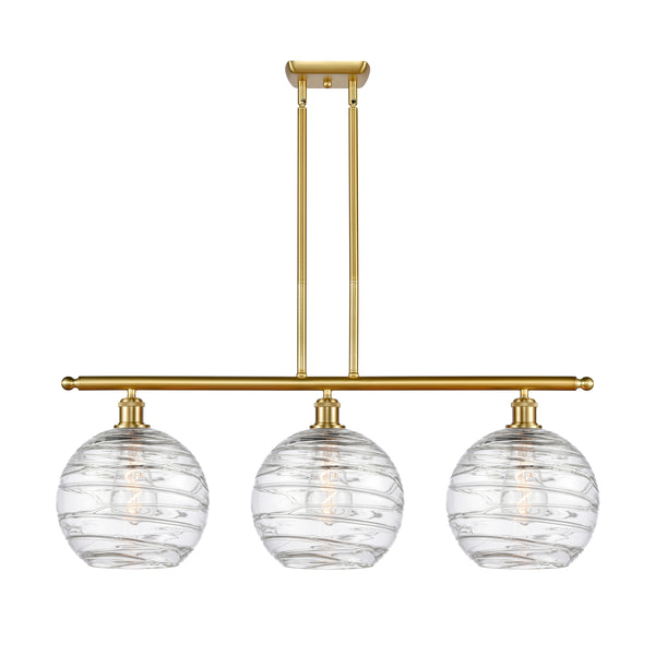 Deco Swirl Island Light shown in the Satin Gold finish with a Clear shade