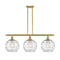 Deco Swirl Island Light shown in the Satin Gold finish with a Clear shade