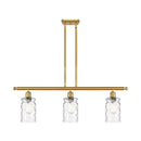 Candor Island Light shown in the Satin Gold finish with a Clear Waterglass shade