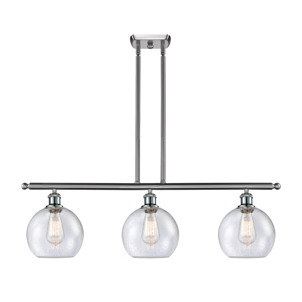 Athens Island Light shown in the Brushed Satin Nickel finish with a Seedy shade