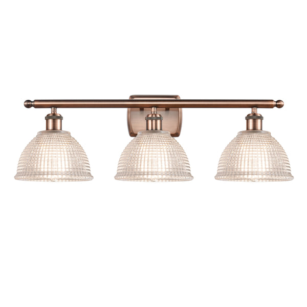 Arietta Bath Vanity Light shown in the Antique Copper finish with a Clear shade
