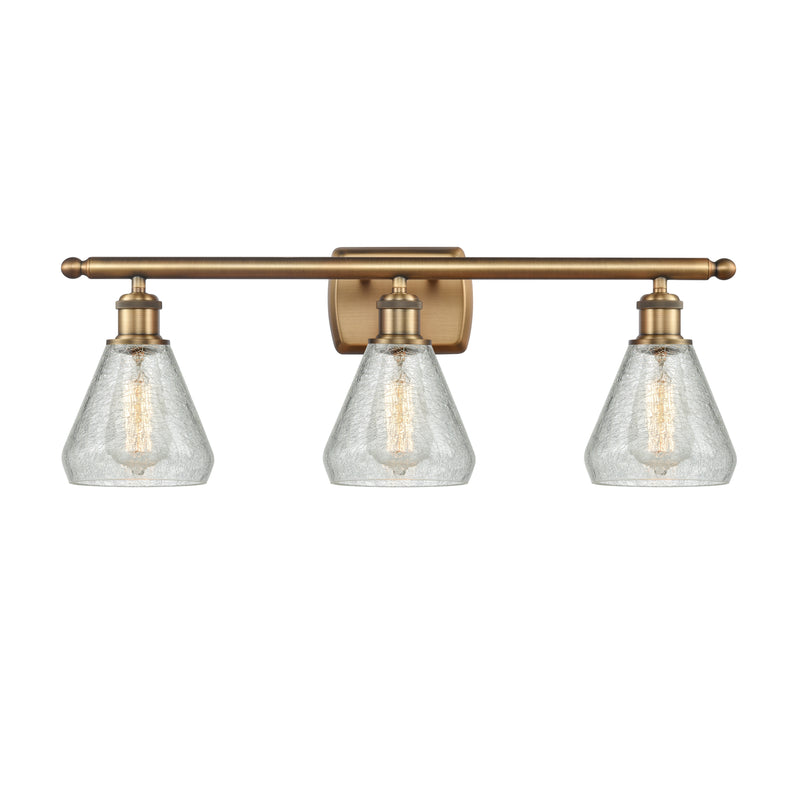 Conesus Bath Vanity Light shown in the Brushed Brass finish with a Clear Crackle shade
