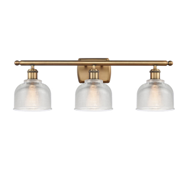 Dayton Bath Vanity Light shown in the Brushed Brass finish with a Clear shade