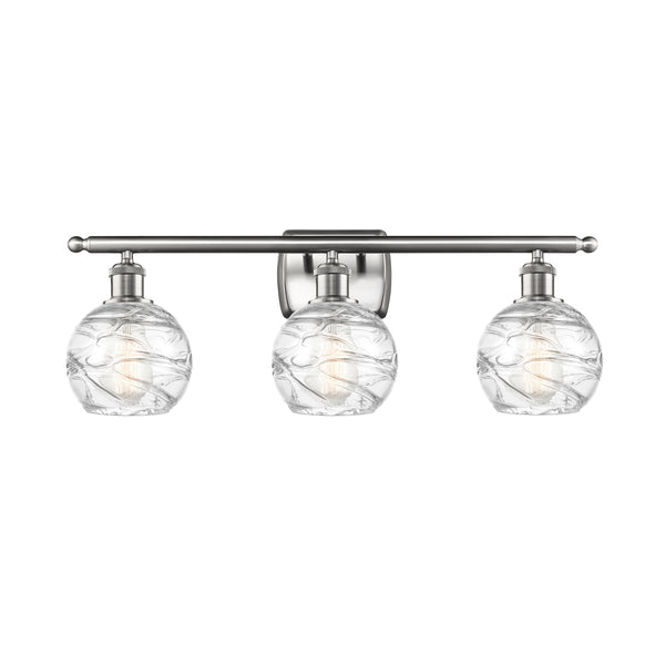 Deco Swirl Bath Vanity Light shown in the Brushed Satin Nickel finish with a Clear shade