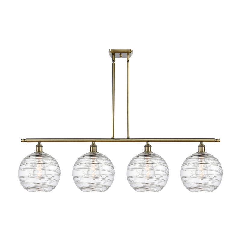 Deco Swirl Island Light shown in the Antique Brass finish with a Clear shade