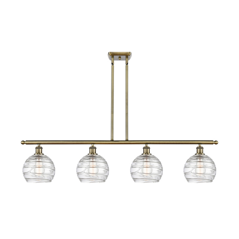 Deco Swirl Island Light shown in the Antique Brass finish with a Clear shade