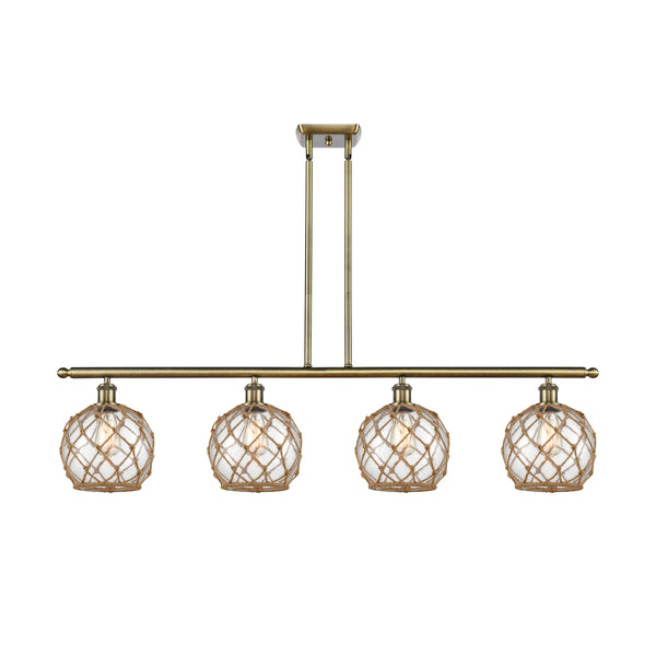 Farmhouse Rope Island Light shown in the Antique Brass finish with a Clear Glass with Brown Rope shade