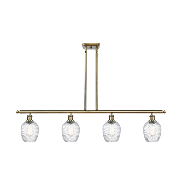 Salina Island Light shown in the Antique Brass finish with a Clear Spiral Fluted shade