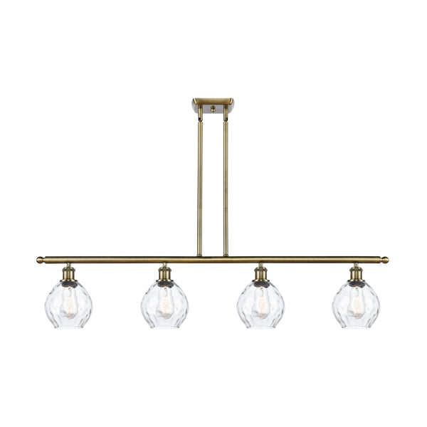 Waverly Island Light shown in the Antique Brass finish with a Clear shade