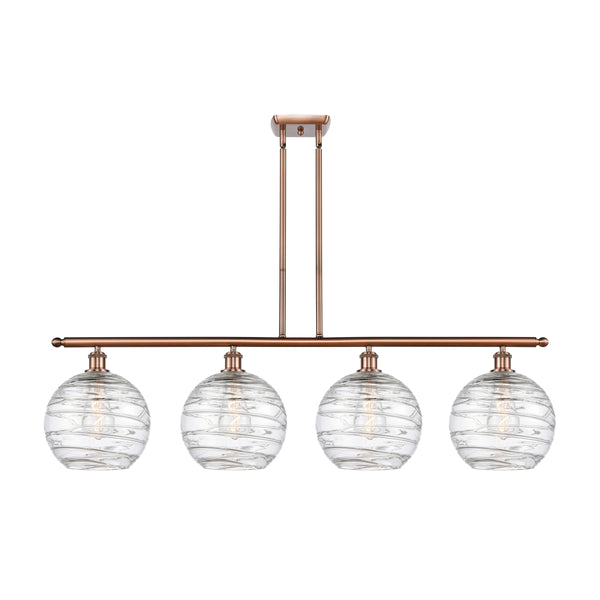 Deco Swirl Island Light shown in the Antique Copper finish with a Clear shade