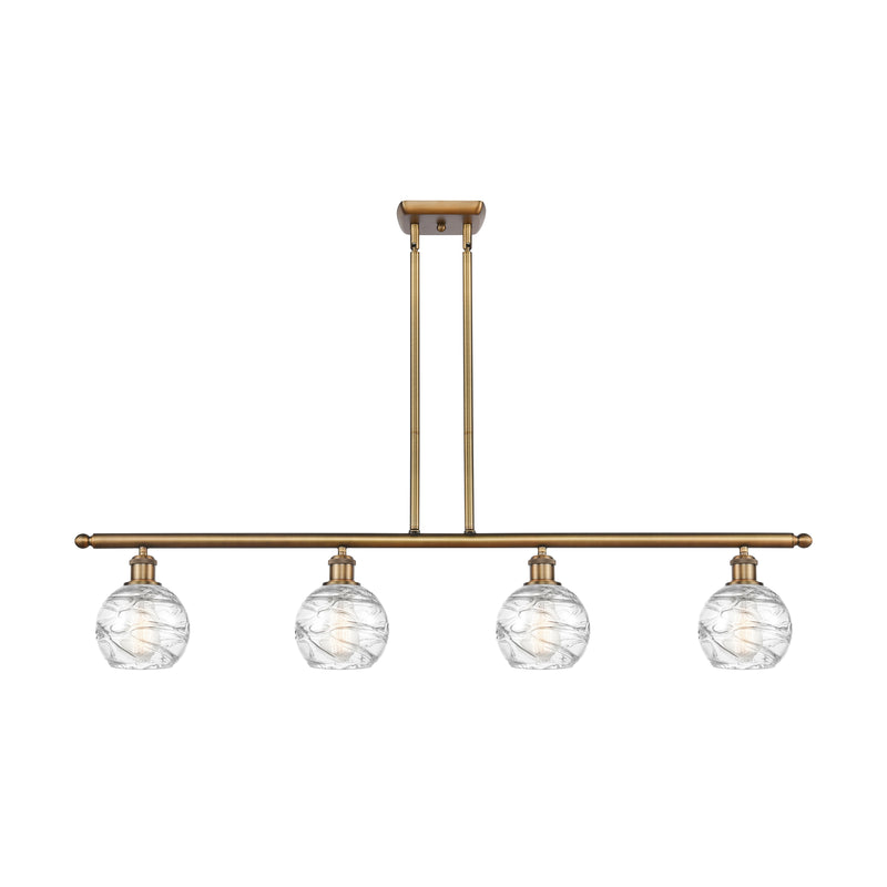 Deco Swirl Island Light shown in the Brushed Brass finish with a Clear shade