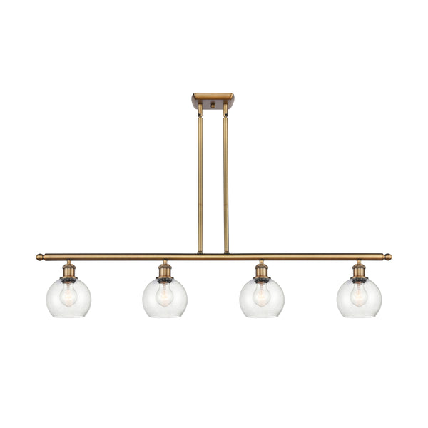 Athens Island Light shown in the Brushed Brass finish with a Seedy shade