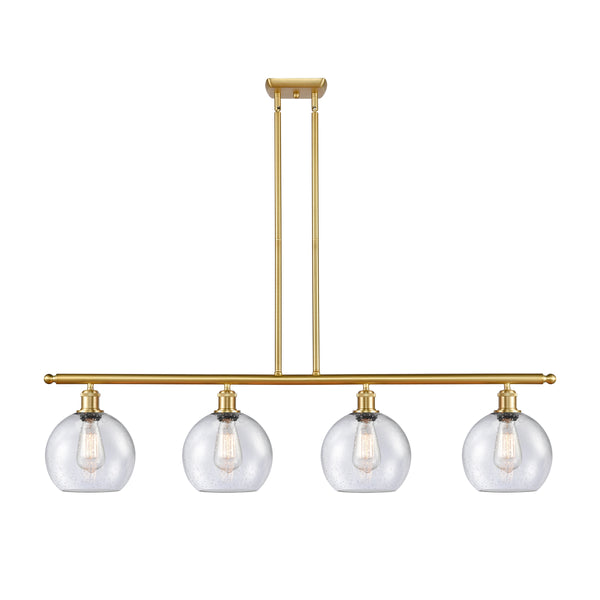 Athens Island Light shown in the Satin Gold finish with a Seedy shade