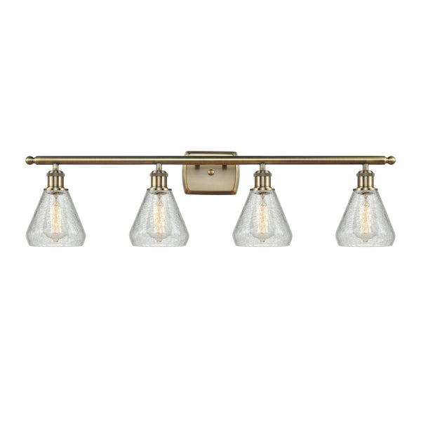 Conesus Bath Vanity Light shown in the Antique Brass finish with a Clear Crackle shade