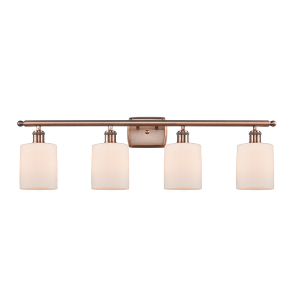 Cobbleskill Bath Vanity Light shown in the Antique Copper finish with a Matte White shade