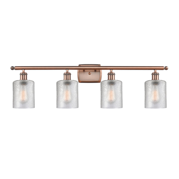 Cobbleskill Bath Vanity Light shown in the Antique Copper finish with a Clear shade