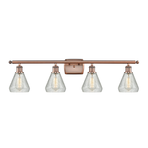 Conesus Bath Vanity Light shown in the Antique Copper finish with a Clear Crackle shade
