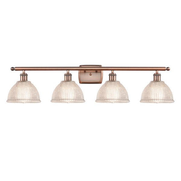 Arietta Bath Vanity Light shown in the Antique Copper finish with a Clear shade