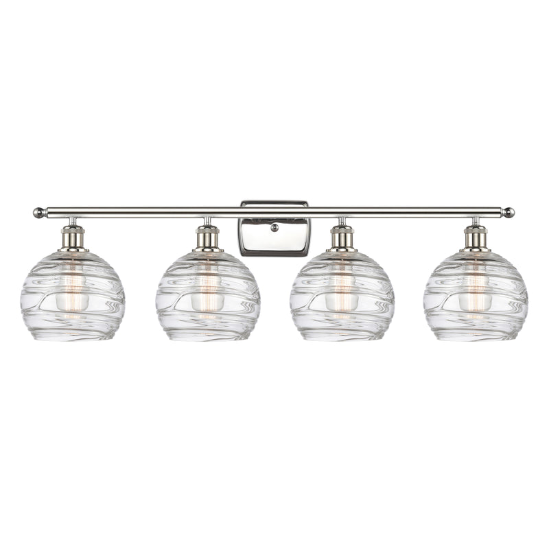 Deco Swirl Bath Vanity Light shown in the Polished Nickel finish with a Clear shade